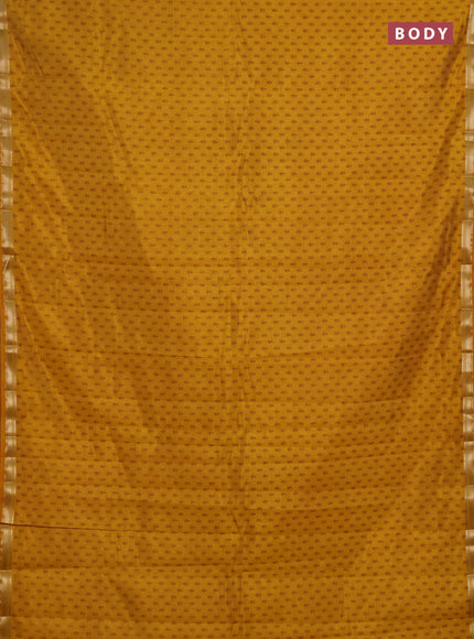 Semi raw silk saree dark mustard shade with allover butta prints and zari woven border