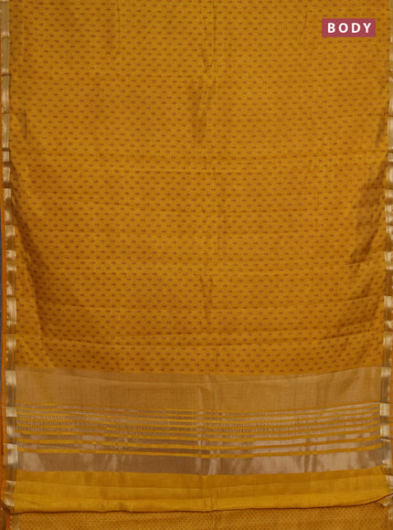 Semi raw silk saree dark mustard shade with allover butta prints and zari woven border