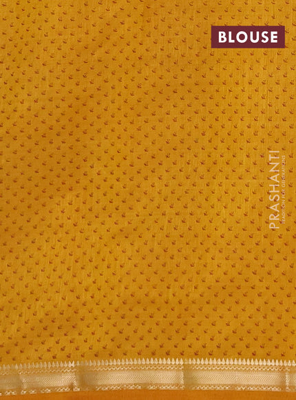 Semi raw silk saree dark mustard shade with allover butta prints and zari woven border