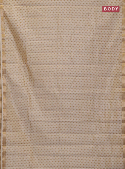 Semi raw silk saree cream with allover butta prints and zari woven border