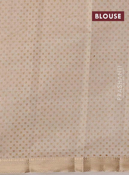 Semi raw silk saree cream with allover butta prints and zari woven border