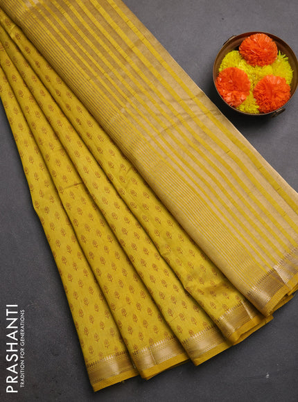 Semi raw silk saree mustard yellow shade with allover butta prints and zari woven border