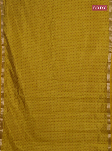 Semi raw silk saree mustard yellow shade with allover butta prints and zari woven border