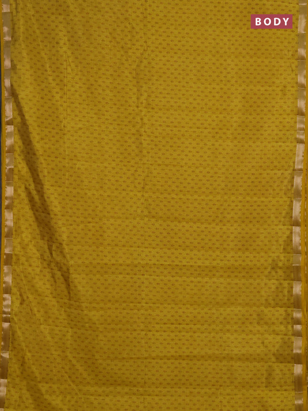 Semi raw silk saree mustard yellow shade with allover butta prints and zari woven border