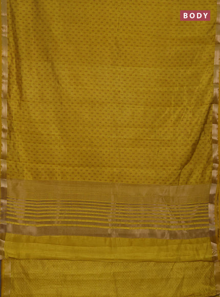 Semi raw silk saree mustard yellow shade with allover butta prints and zari woven border