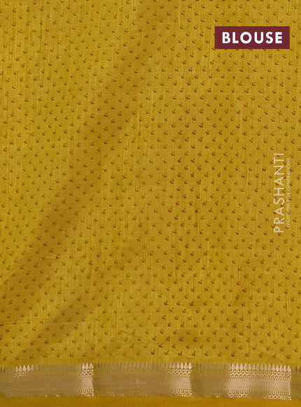 Semi raw silk saree mustard yellow shade with allover butta prints and zari woven border