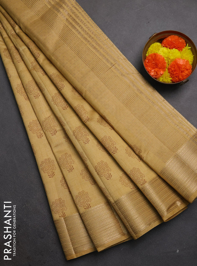 Semi raw silk saree sandal with allover floral butta prints and zari woven border