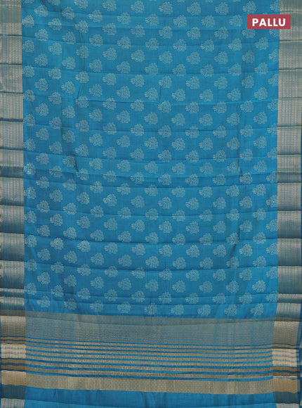 Semi raw silk saree teal blue with allover floral butta prints and zari woven border