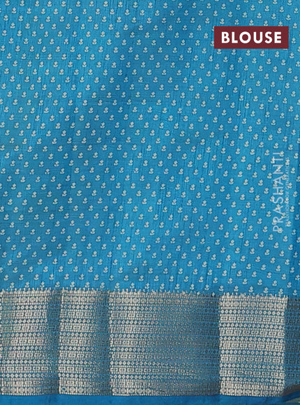 Semi raw silk saree teal blue with allover floral butta prints and zari woven border