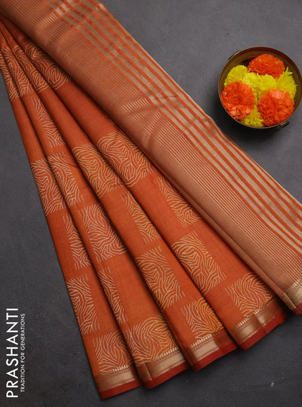 Semi raw silk saree rustic orange shade with allover box style butta prints and small zari woven border