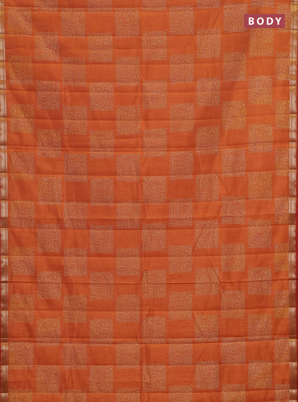 Semi raw silk saree rustic orange shade with allover box style butta prints and small zari woven border