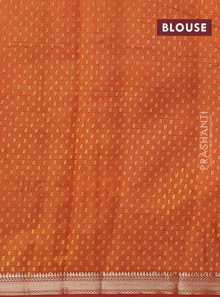 Semi raw silk saree rustic orange shade with allover box style butta prints and small zari woven border
