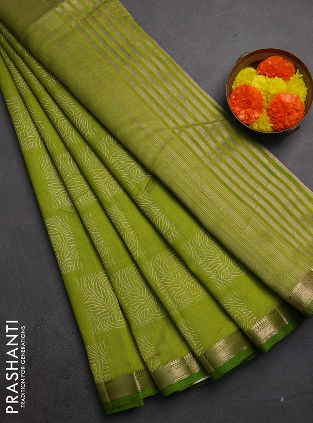 Semi raw silk saree light green with allover box style butta prints and small zari woven border