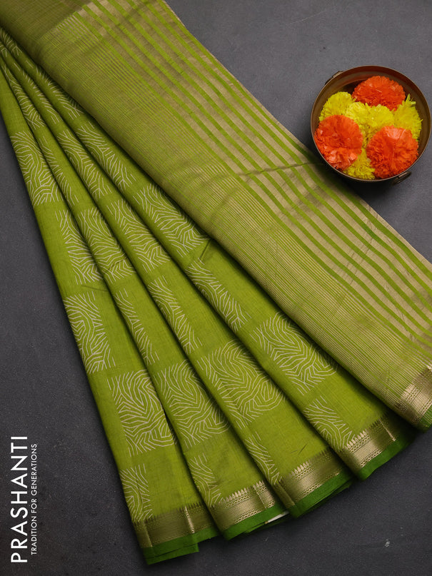 Semi raw silk saree light green with allover box style butta prints and small zari woven border