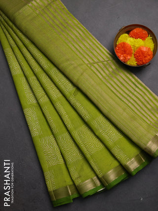 Semi raw silk saree light green with allover box style butta prints and small zari woven border