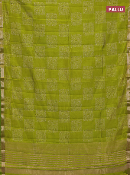 Semi raw silk saree light green with allover box style butta prints and small zari woven border