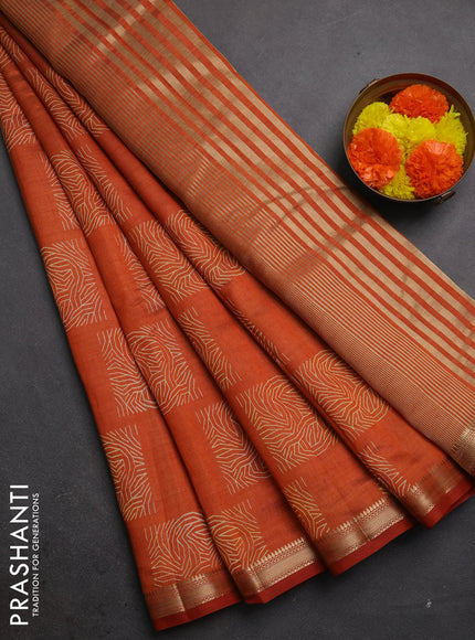 Semi raw silk saree rustic orange with allover box style butta prints and small zari woven border