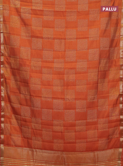 Semi raw silk saree rustic orange with allover box style butta prints and small zari woven border