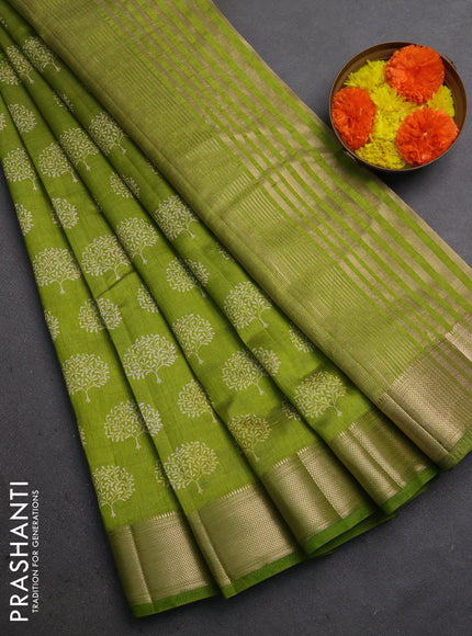 Semi raw silk saree light green with allover butta prints and zari woven border