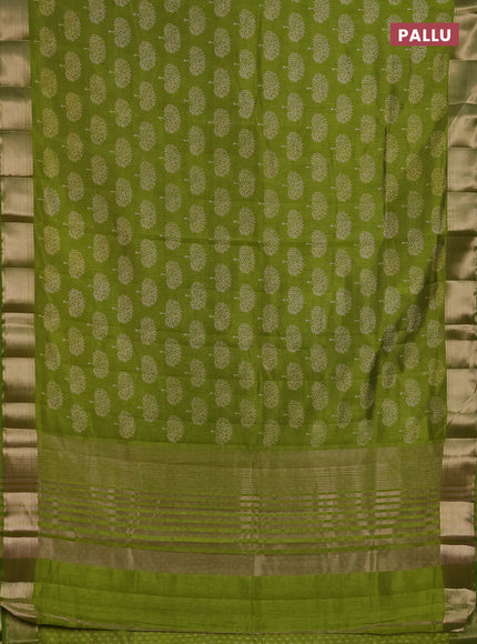 Semi raw silk saree light green with allover butta prints and zari woven border