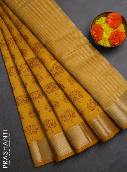 Semi raw silk saree dark mustard with allover butta prints and zari woven border