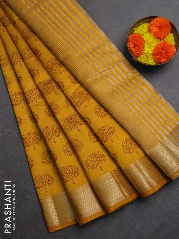 Semi raw silk saree dark mustard with allover butta prints and zari woven border
