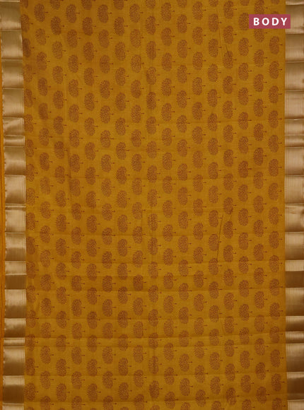 Semi raw silk saree dark mustard with allover butta prints and zari woven border