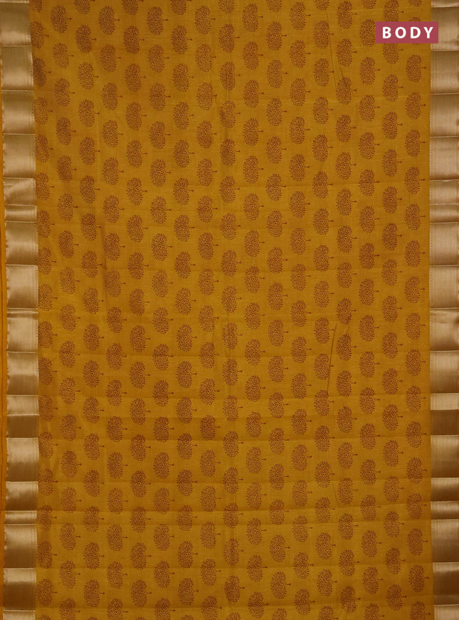 Semi raw silk saree dark mustard with allover butta prints and zari woven border