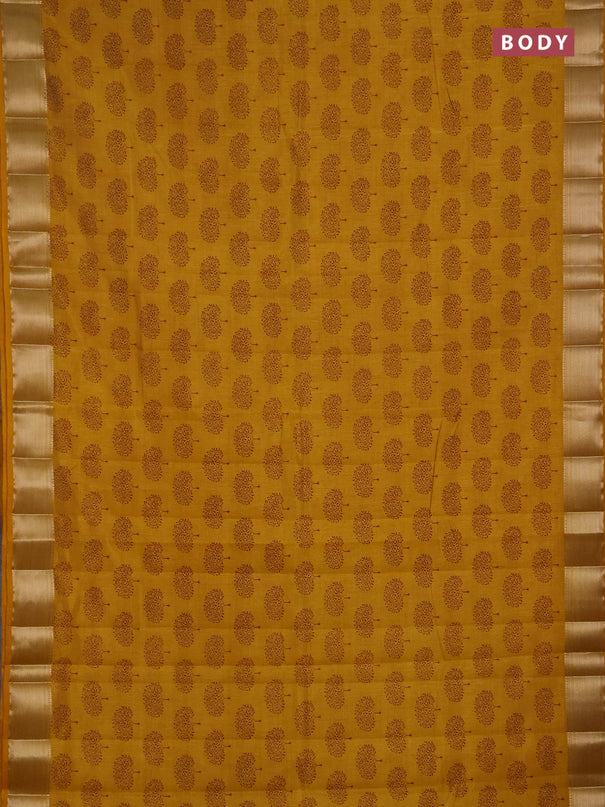 Semi raw silk saree dark mustard with allover butta prints and zari woven border