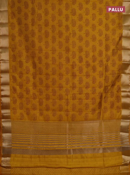 Semi raw silk saree dark mustard with allover butta prints and zari woven border
