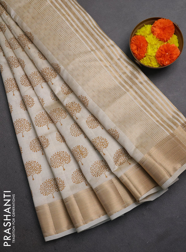 Semi raw silk saree cream with allover butta prints and zari woven border