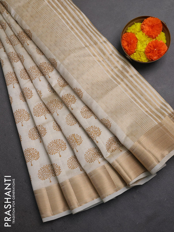 Semi raw silk saree cream with allover butta prints and zari woven border