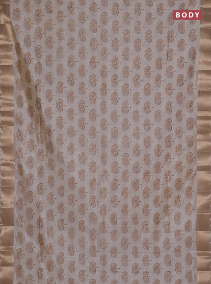 Semi raw silk saree cream with allover butta prints and zari woven border