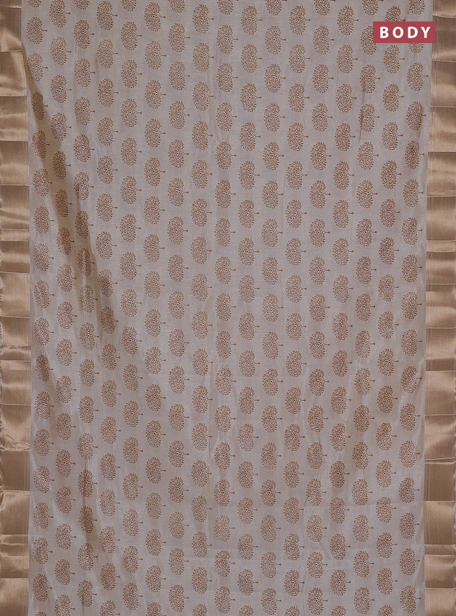 Semi raw silk saree cream with allover butta prints and zari woven border