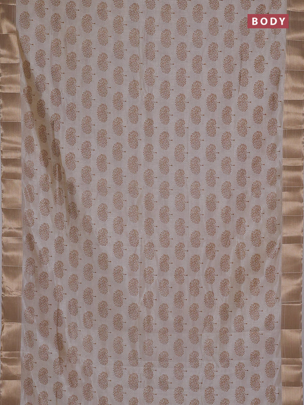 Semi raw silk saree cream with allover butta prints and zari woven border