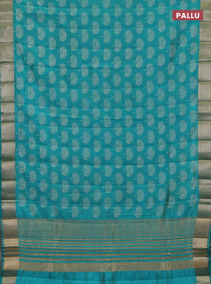 Semi raw silk saree teal green with allover butta prints and zari woven border