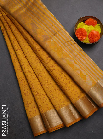 Semi raw silk saree dark mustard with allover geometric prints and zari woven border