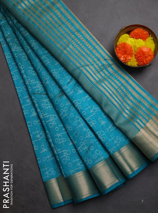Semi raw silk saree teal green with allover geometric prints and zari woven border