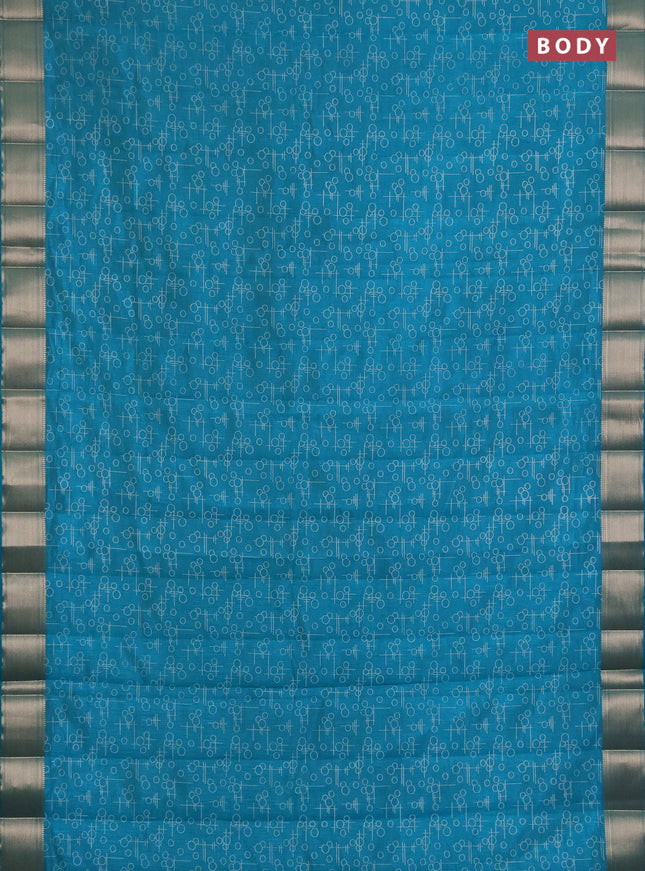 Semi raw silk saree teal green with allover geometric prints and zari woven border