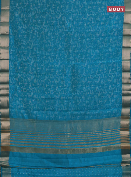 Semi raw silk saree teal green with allover geometric prints and zari woven border