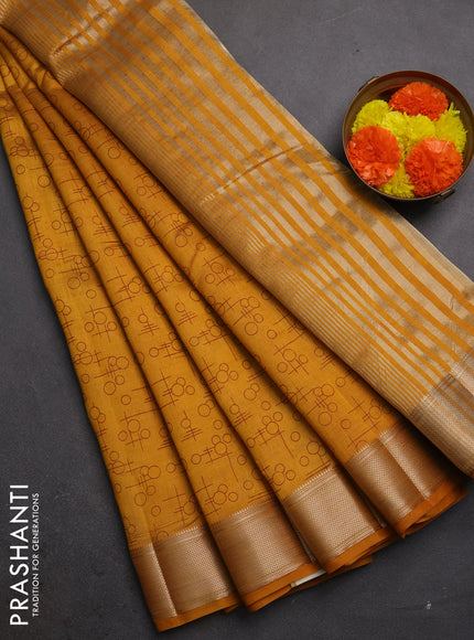 Semi raw silk saree dark mustard shade with allover geometric prints and zari woven border