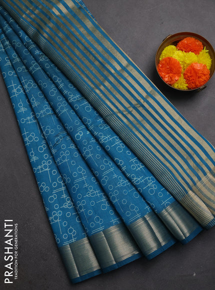 Semi raw silk saree teal blue with allover geometric prints and zari woven border