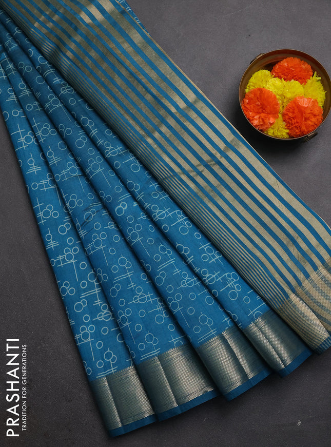Semi raw silk saree teal blue with allover geometric prints and zari woven border