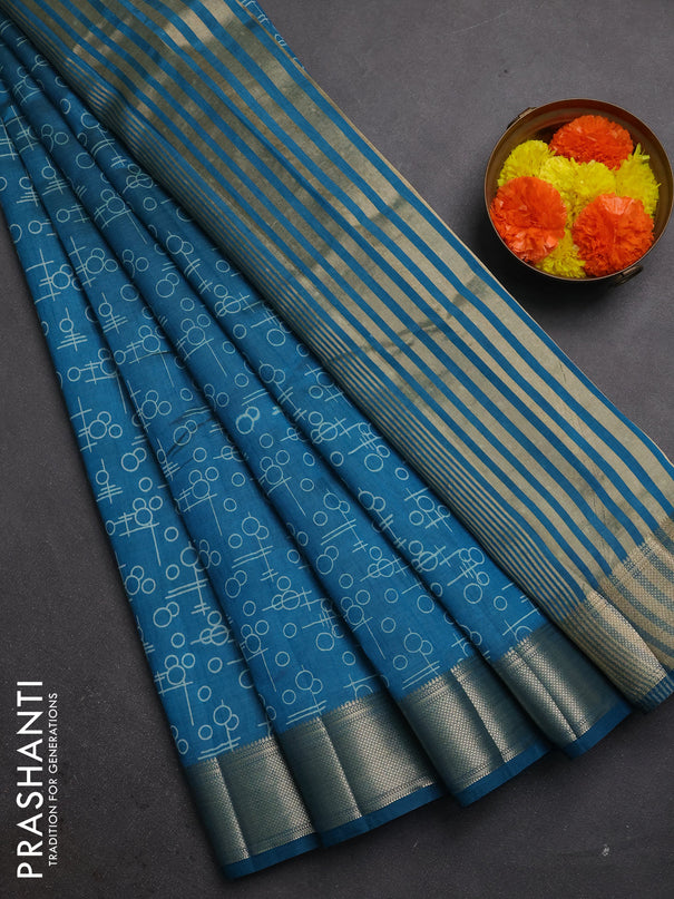 Semi raw silk saree teal blue with allover geometric prints and zari woven border