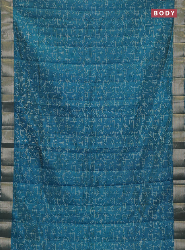 Semi raw silk saree teal blue with allover geometric prints and zari woven border
