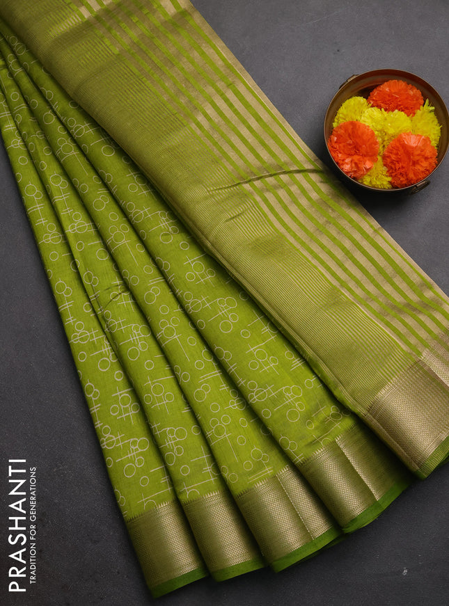Semi raw silk saree light green with allover geometric prints and zari woven border