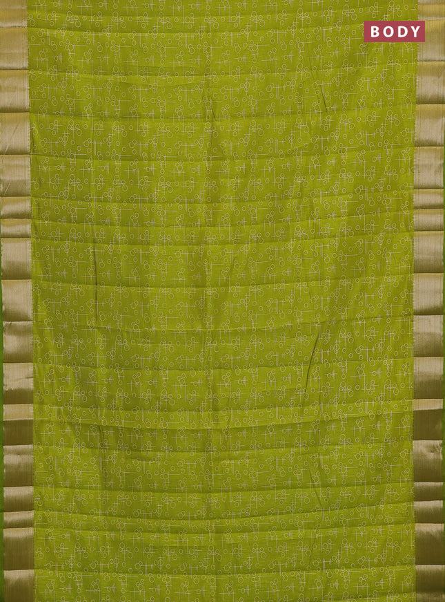 Semi raw silk saree light green with allover geometric prints and zari woven border