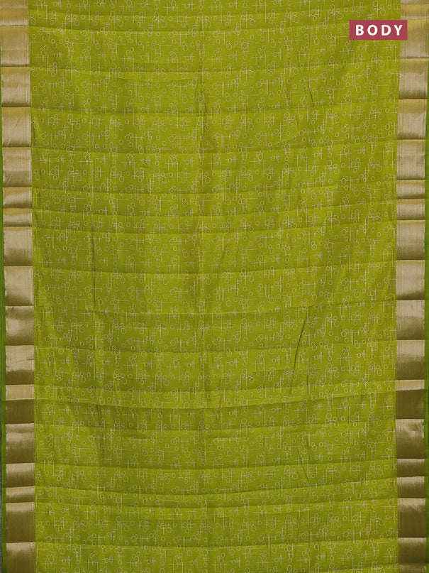 Semi raw silk saree light green with allover geometric prints and zari woven border