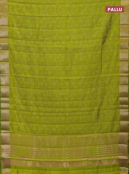 Semi raw silk saree light green with allover geometric prints and zari woven border