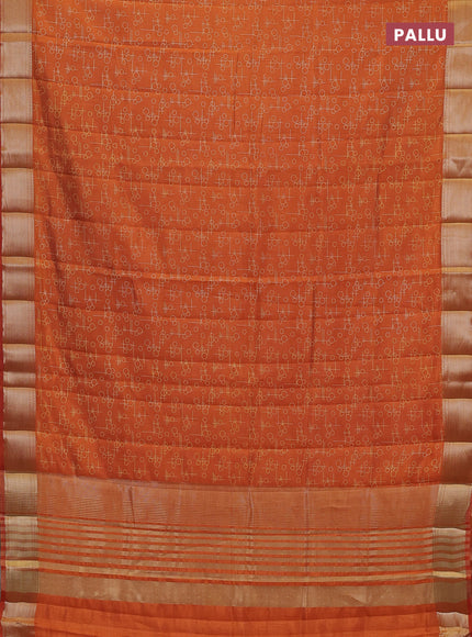 Semi raw silk saree rustic orange with allover geometric prints and zari woven border
